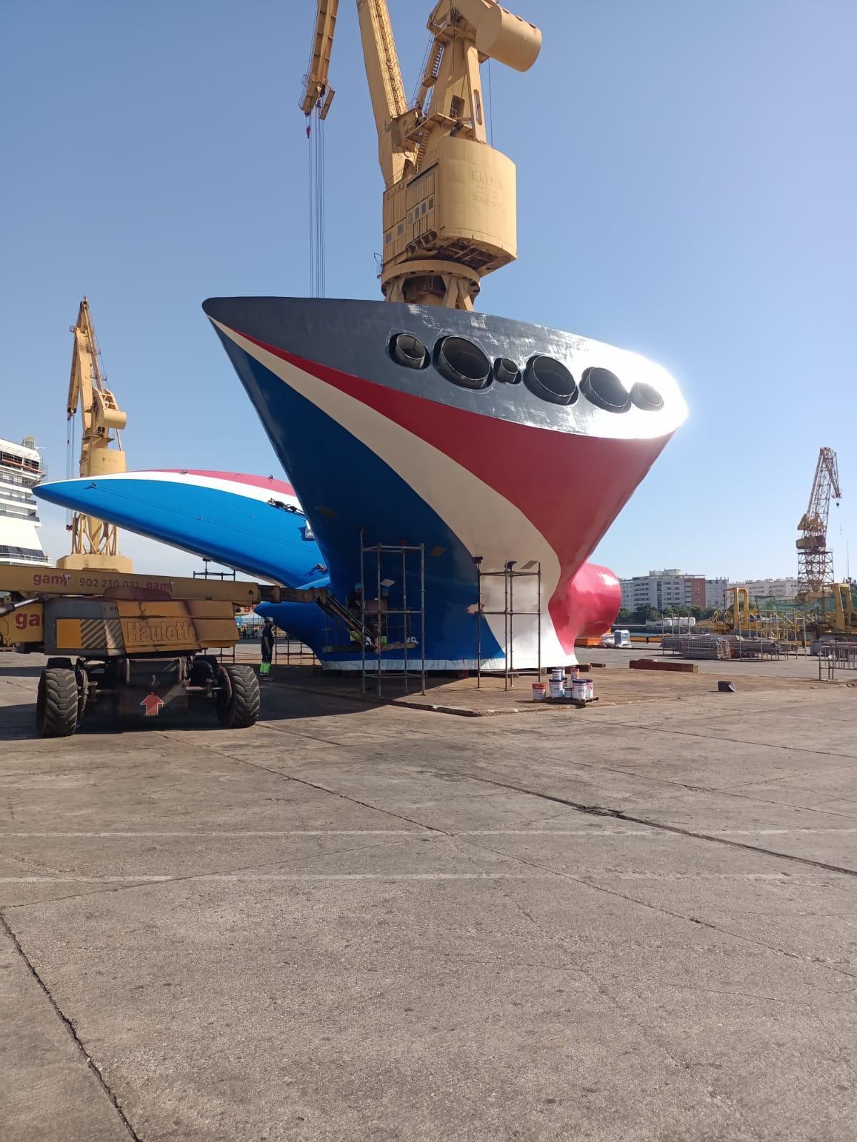 Newbuild bow section lifted by crane at the shipyard