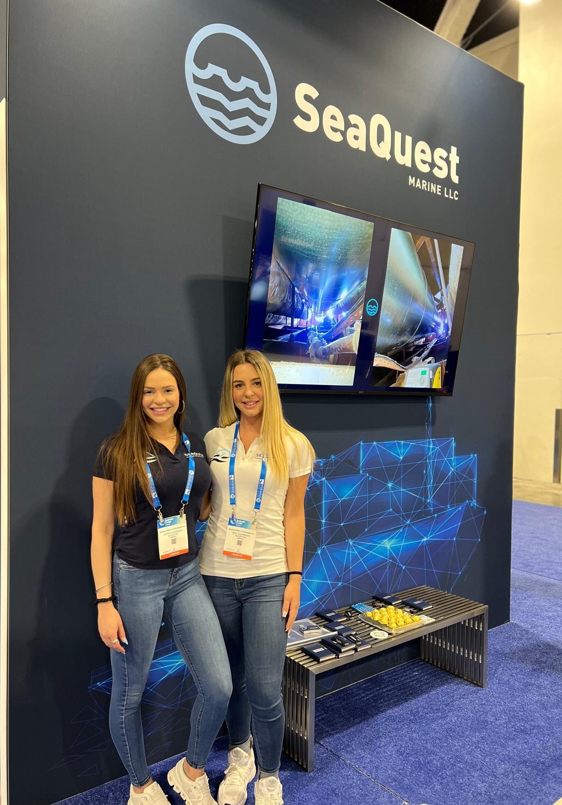 SeaQuest team representatives at the SeaQuest exhibition booth