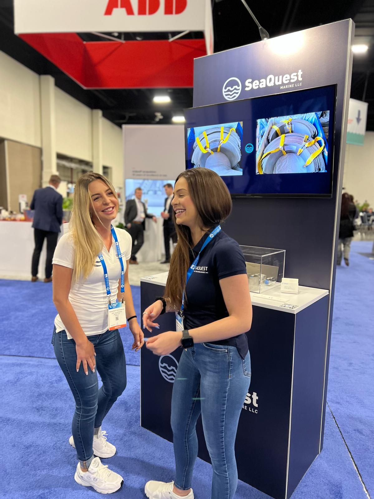 SeaQuest team representatives at an industry trade show booth