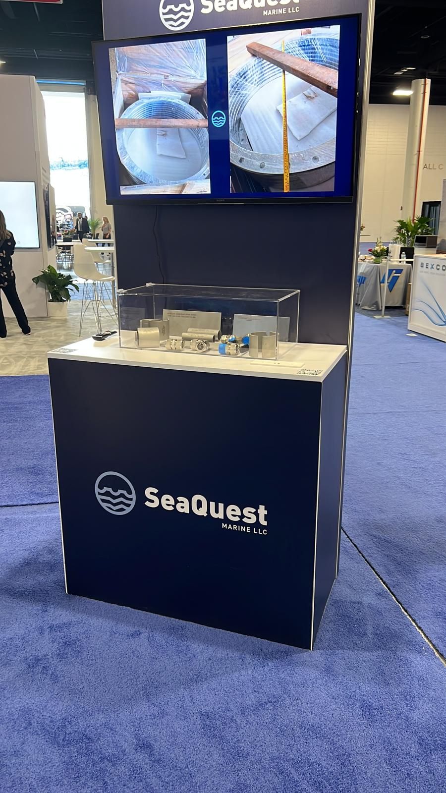 SeaQuest branded product display counter at an industry trade show