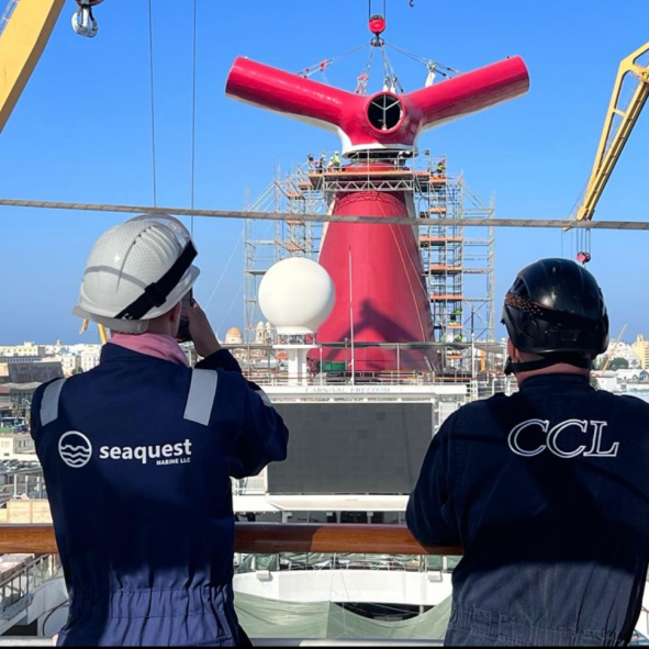SeaQuest engineers on deck alongside a client cruise vessel